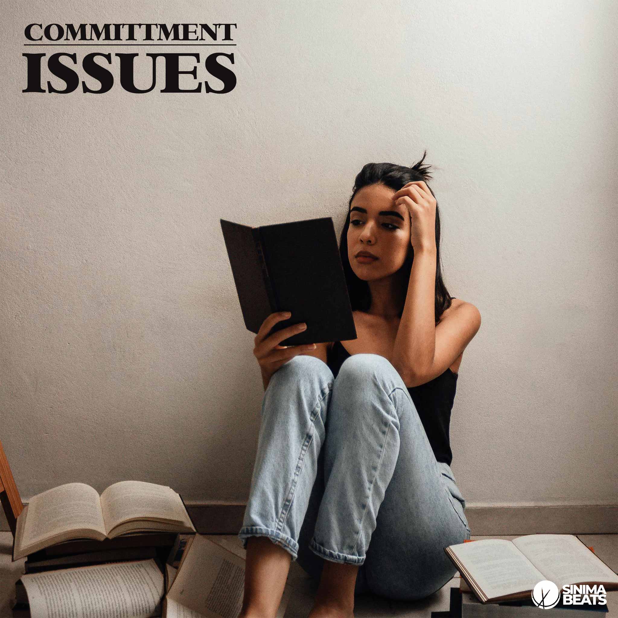 A young woman with commitment issues sits barefoot on the floor in a cozy room, wearing light blue jeans and reading a book. She is surrounded by stacks of books, reflecting introspection and emotional depth. - Commitment Issues by SINIMA BEATS