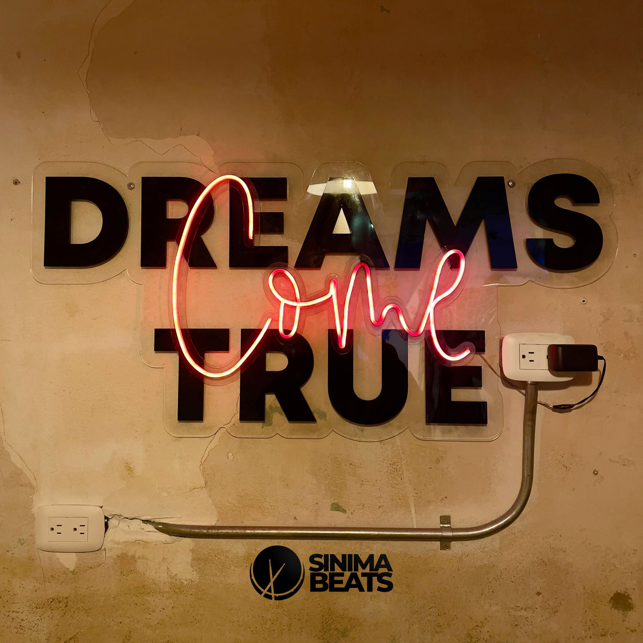 Dreams Come True" wall decor featuring bold title text over a grunge-style background. The wallpaper includes visible electrical outlets with plugs inserted, and the words are illuminated with a neon light effect for a vibrant, modern look. - Dreams Come True