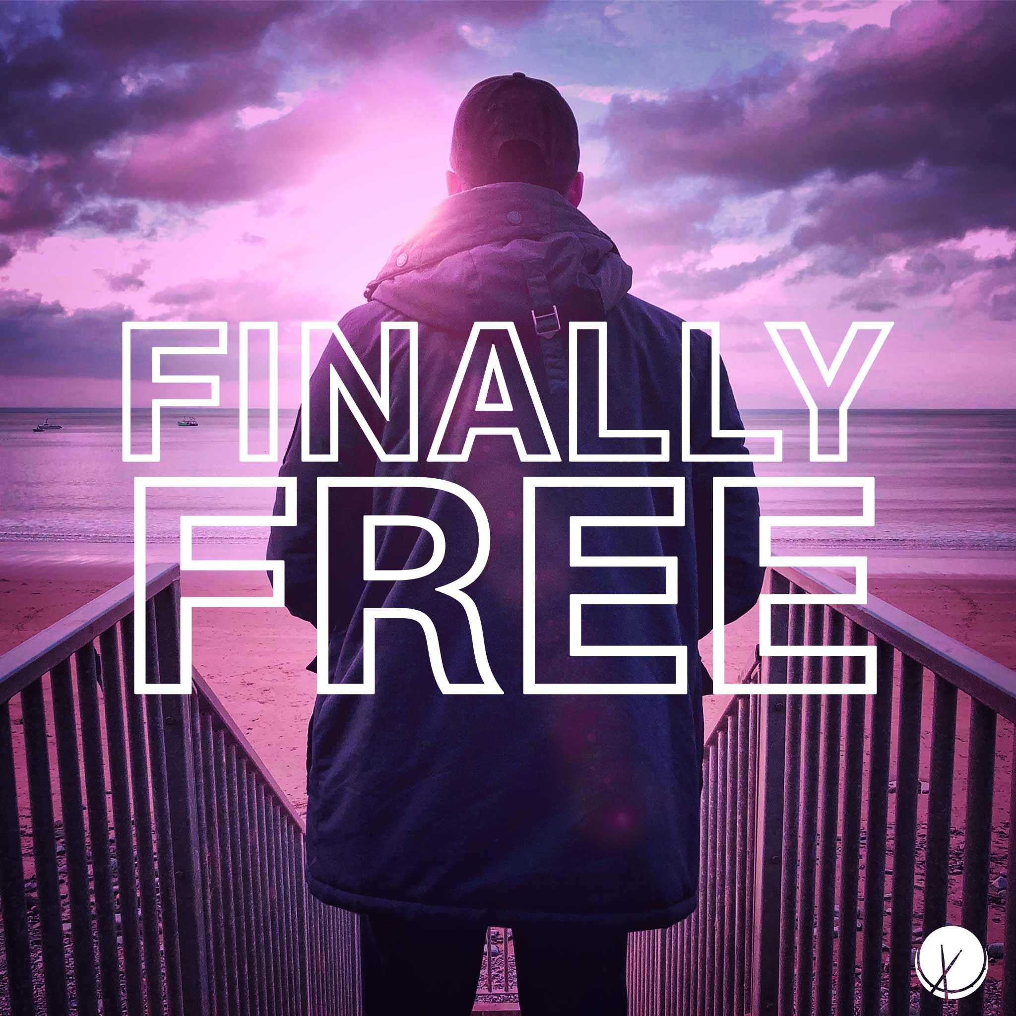 Man Wearing Coat and Baseball Cap Standing Facing Towards Ocean with Purple-Pink Hue - Finally Free