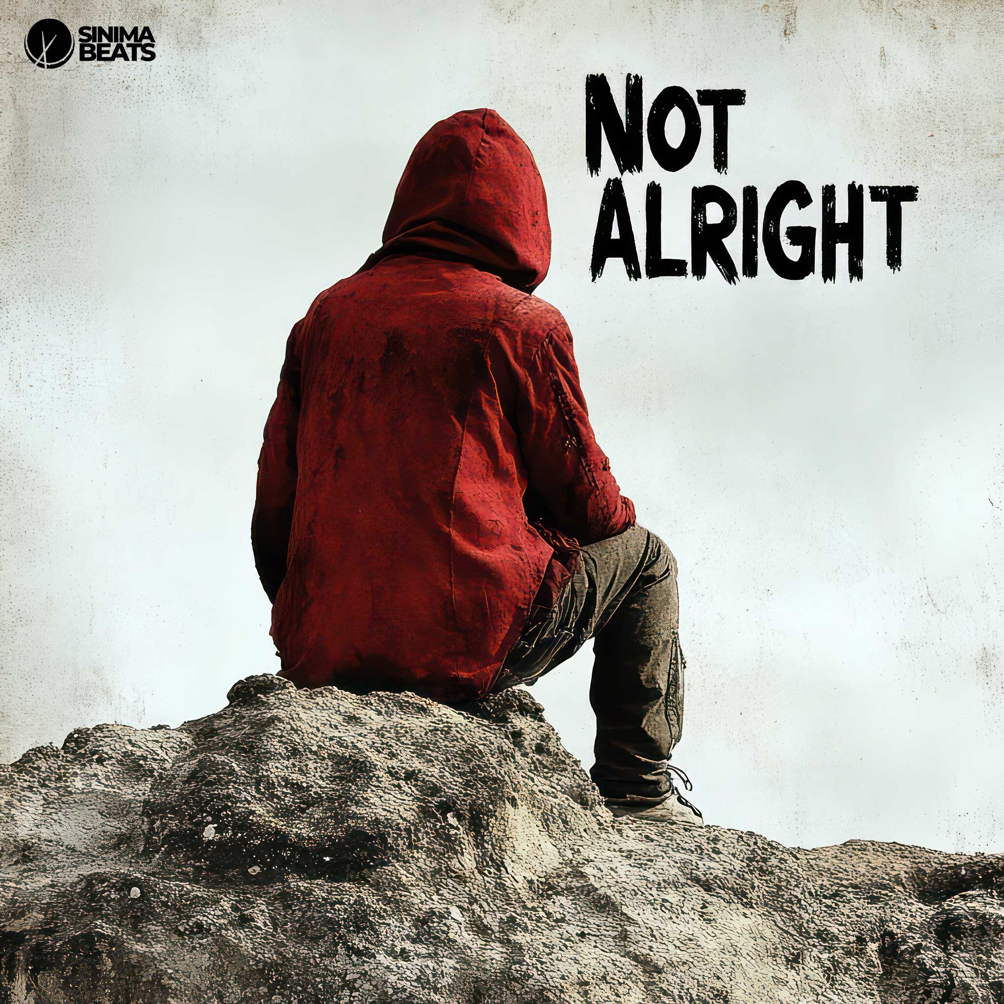 A visually striking image of a man sitting on a large rock, dressed in a red hooded jacket and pants. His disheveled appearance and the textured, faded overlay emphasize a sense of struggle and unease. The man faces outward, capturing a moment of introspection and emotional turmoil. The overall effect conveys the theme of not being alright, with the subdued colors and gritty texture enhancing the mood.