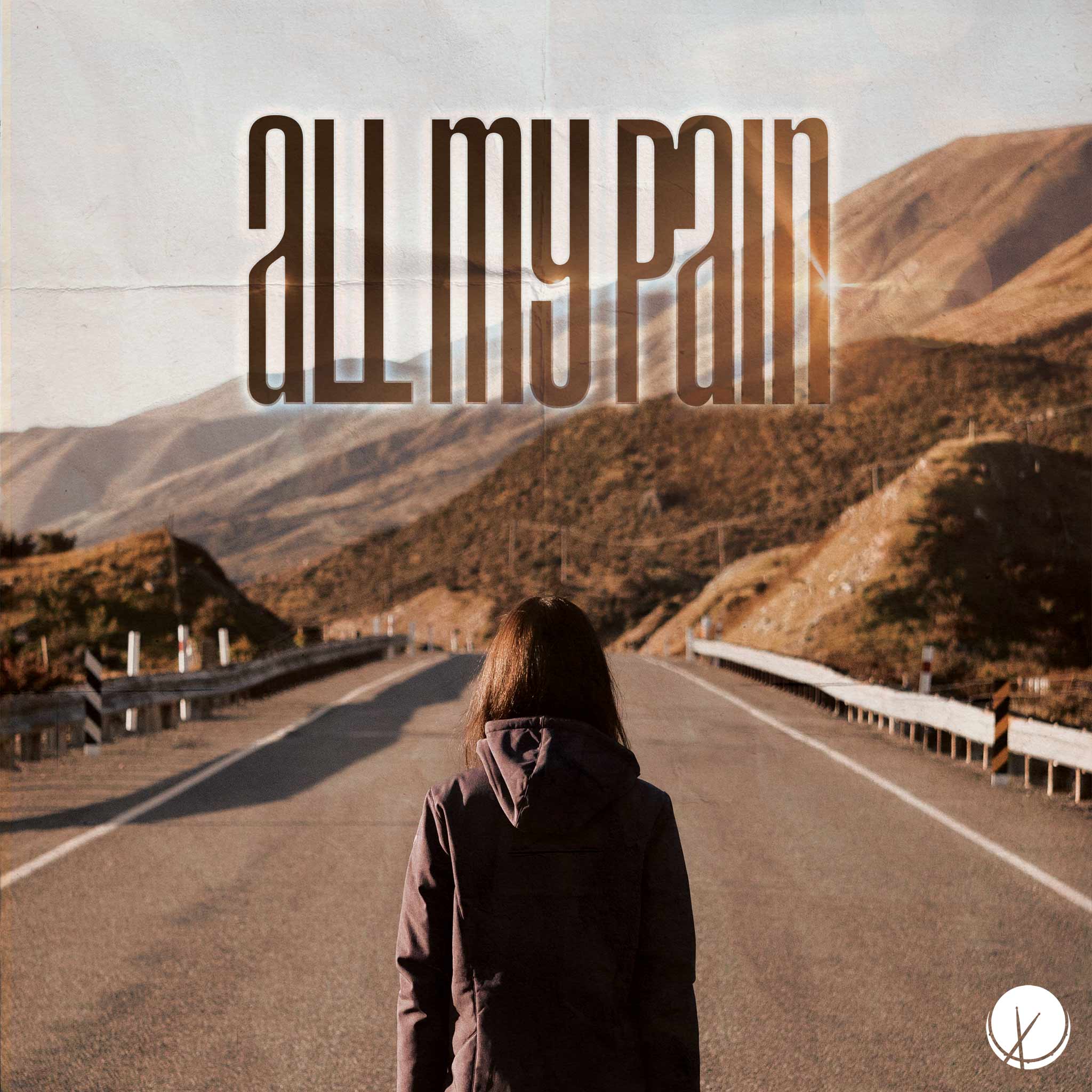 Woman in Hooded Jacket Walking Down an Empty Mountainside Road During the Daytime. Title: "All My Pain."